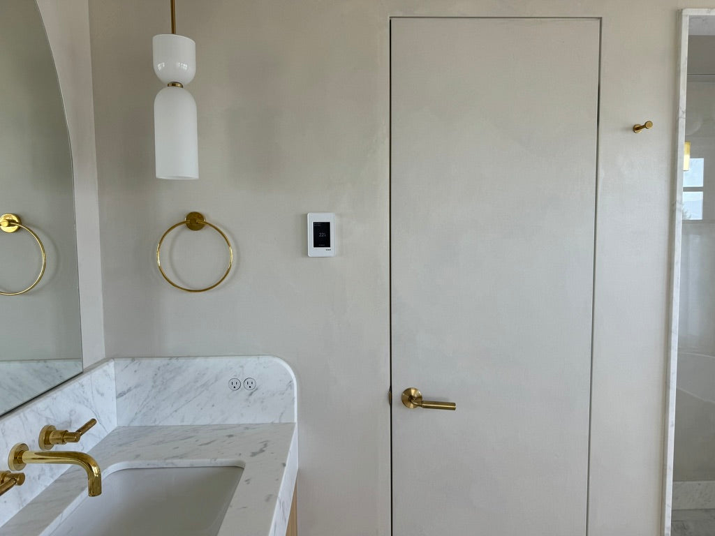 DecoPast bathroom walls and flush door with brass fittings