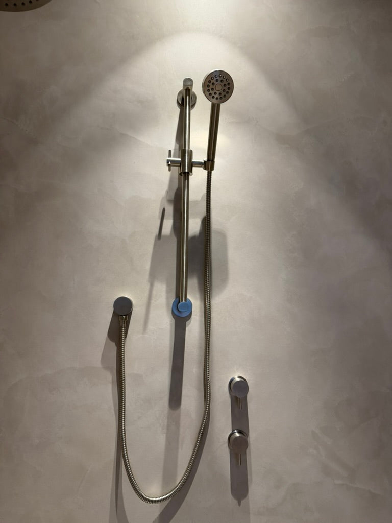 Detail of DecoPast wall movement around shower fixtures