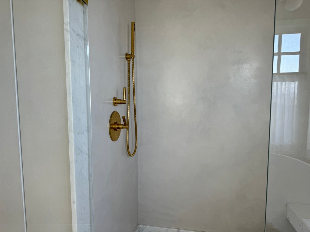 DecoPast shower walls with brass fixtures