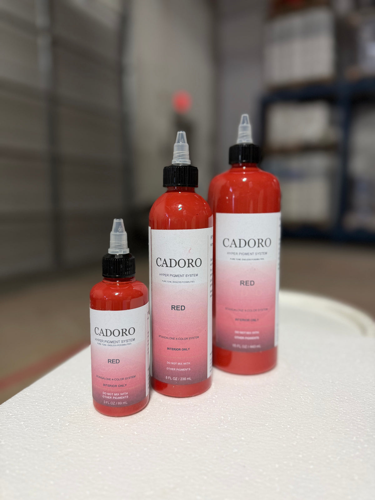 Cadoro Hyper red pigment bottles in 3 oz, 8 oz and 15 oz sizes