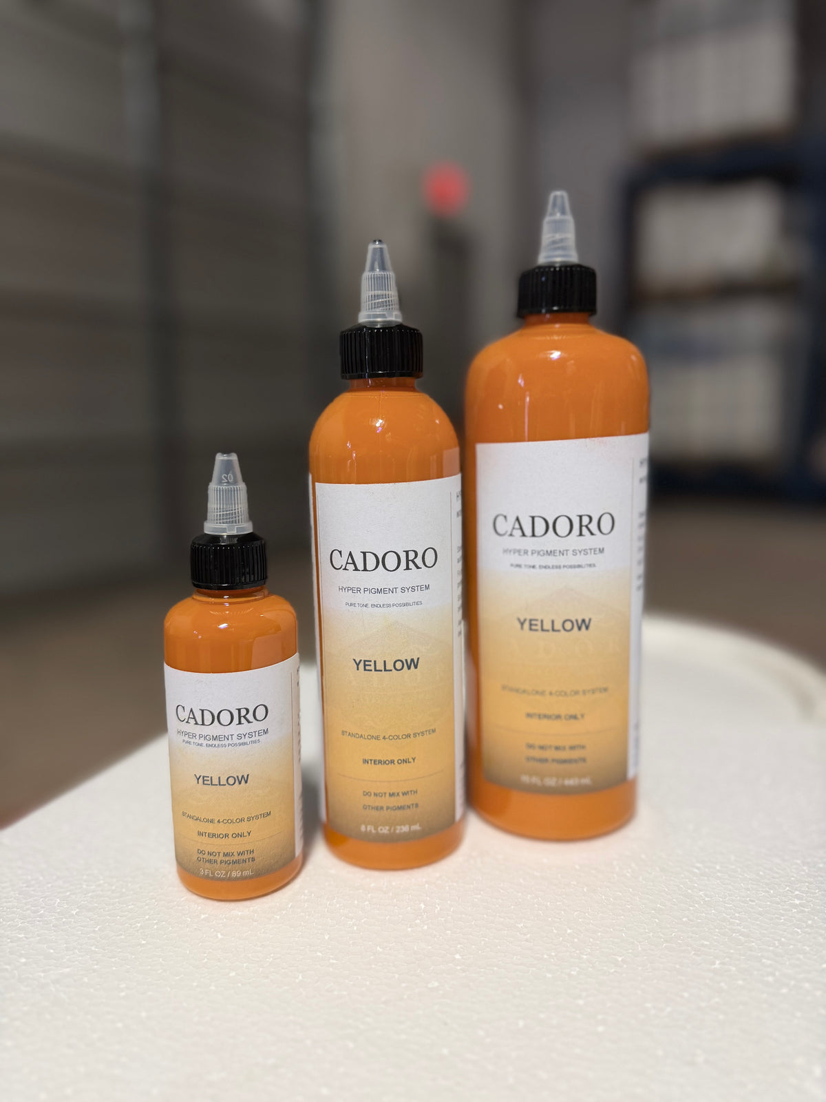 Cadoro Hyper yellow pigment bottles in 3 oz, 8 oz and 15 oz sizes