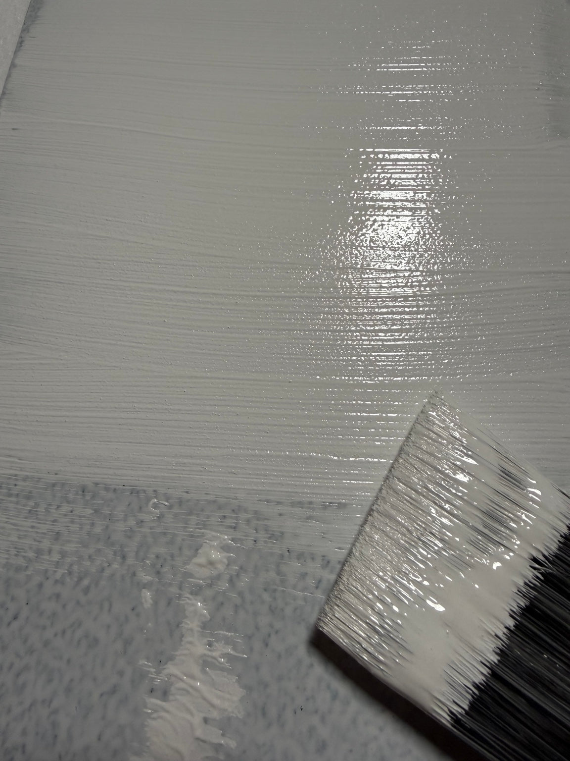 Cadoro Quartz Primer being applied by brush