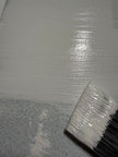 Cadoro Quartz Primer being applied by brush