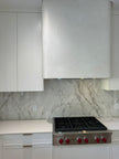 Range hood finished in Cadoro Carrara Coarse plaster